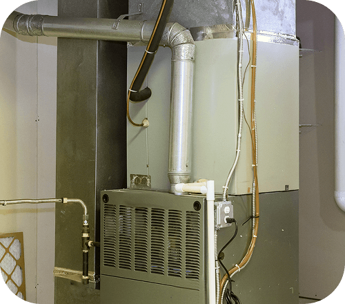 HVAC technician servicing a furnace
